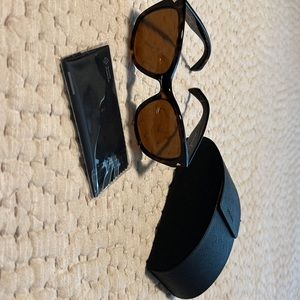 Ladies Prada tortoise frame with amber polarized lens; never worn. EC